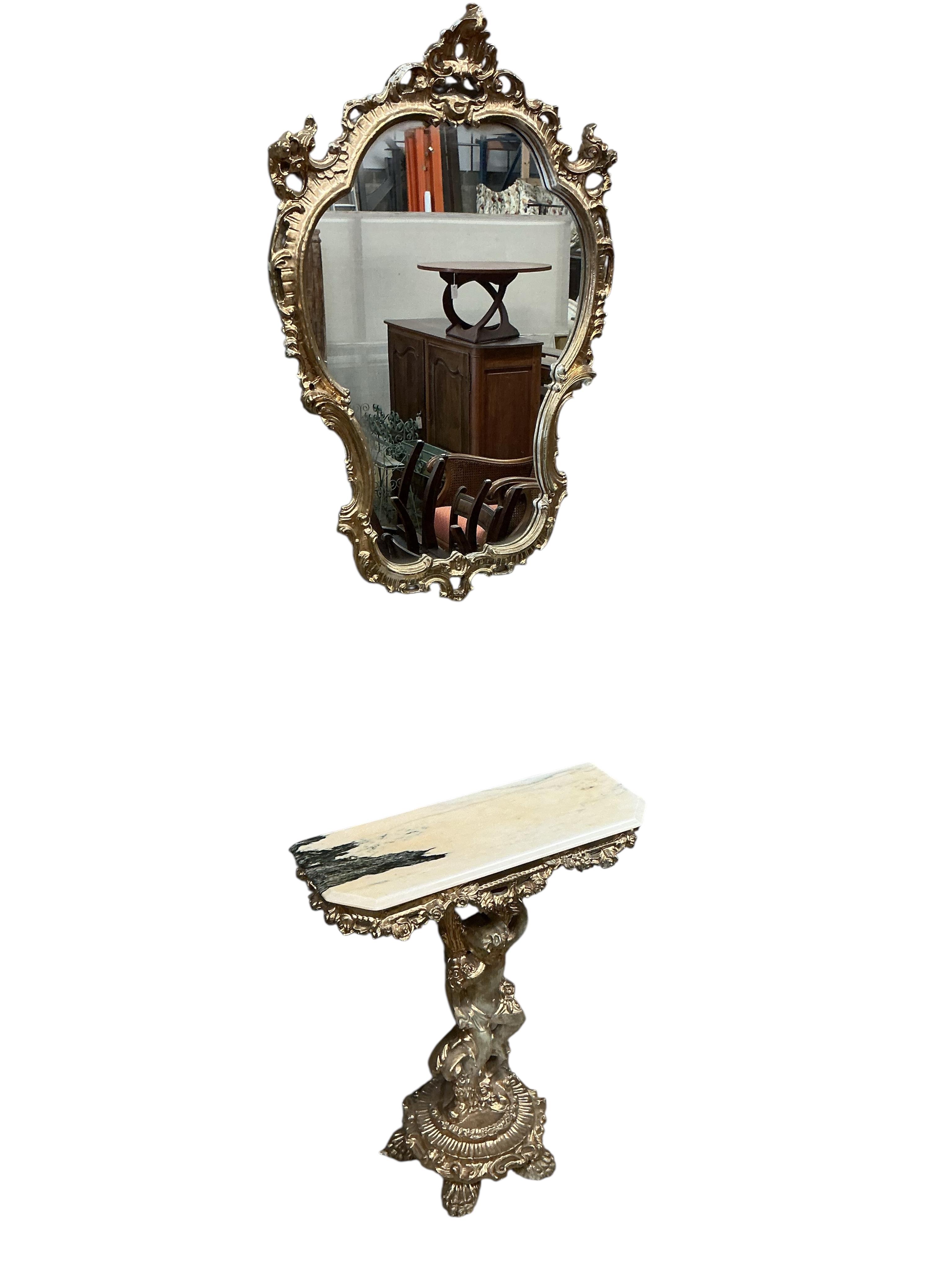 A gilt composition cherub column console table with faux marble top and a similar wall mirror, table width 73cm, depth 26cm, height 83cm.